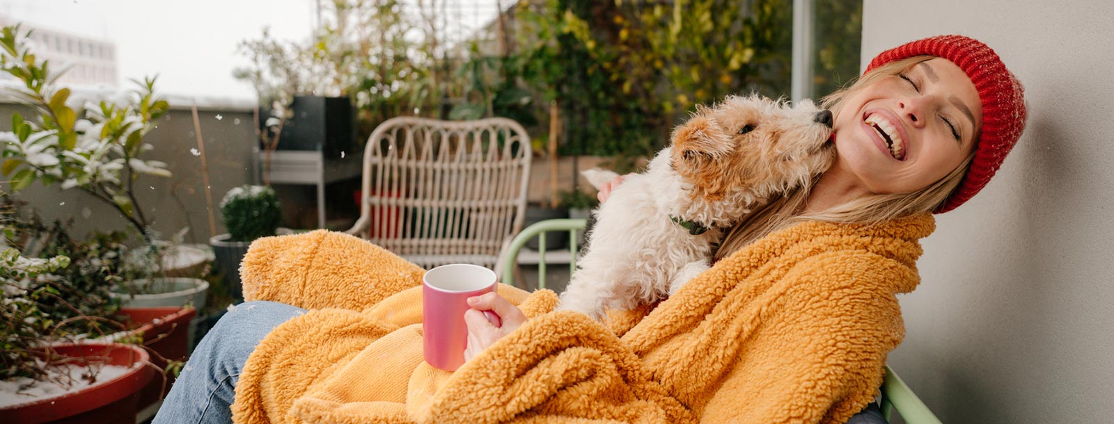 Woman at home with her dog on the patio